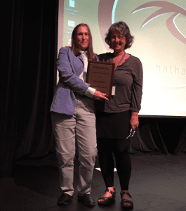 Julie Guthman (right) receives the AFHVS Excellence in Research Award.