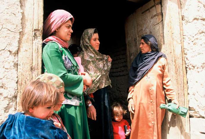 Fig. 6: Women and their children in the farming village of Bustan, Afghanistan.